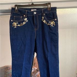Barely worn Skinny Jeans with embroidered florals at pockets.